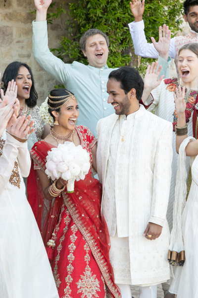 A group of people standing around each other.
